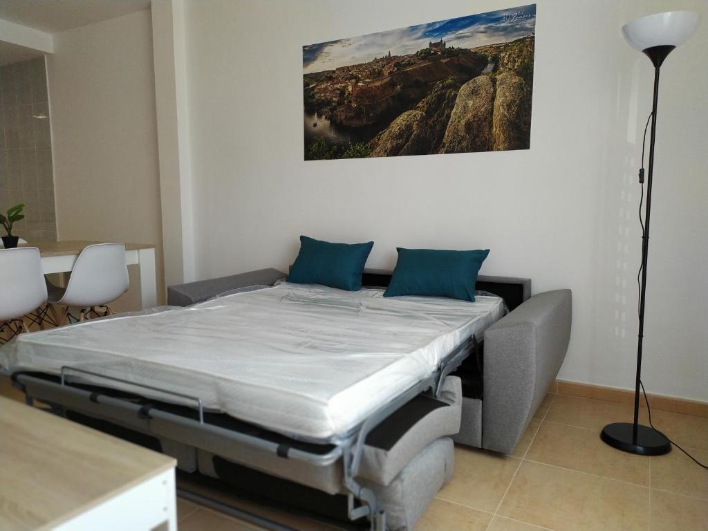 Postel nebo postele na pokoji v ubytování Apartamentos "EL BARCO"