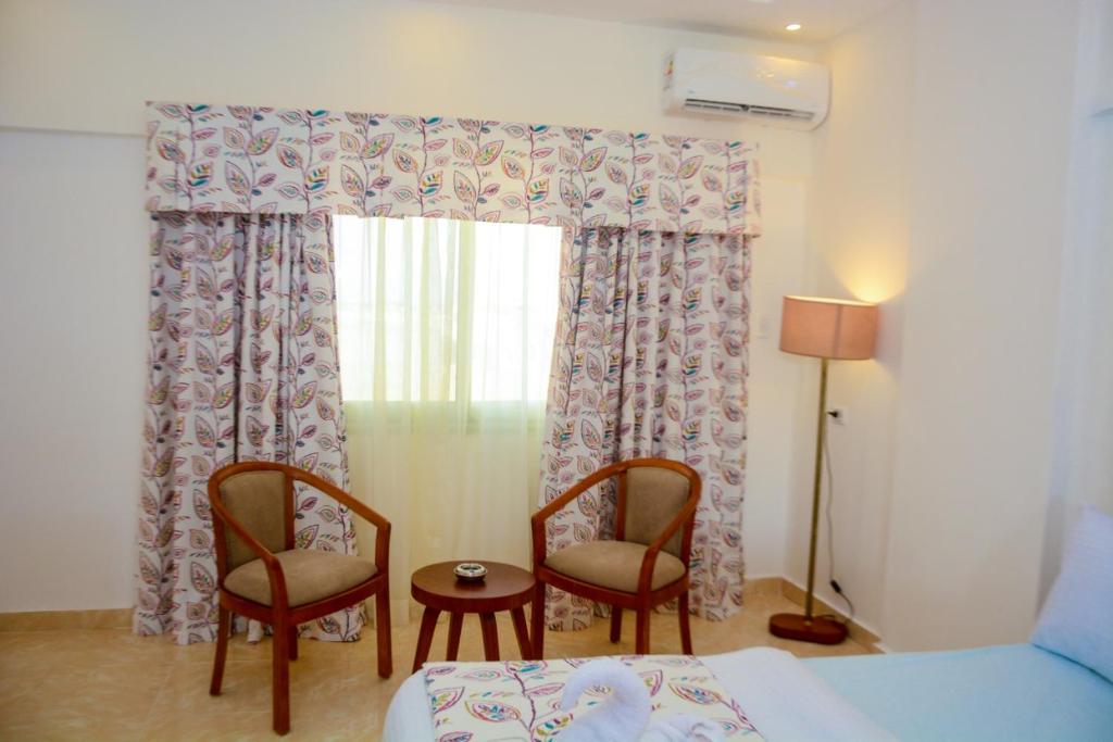 Postel nebo postele na pokoji v ubytování Jewel Matrouh Hotel