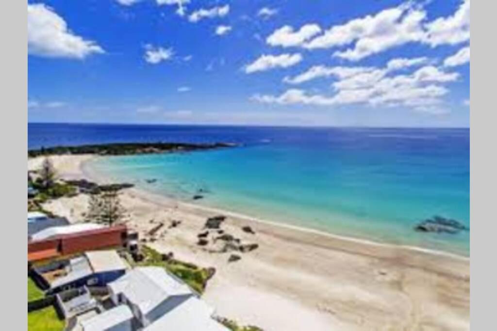 a view of a beach with the ocean at Zoo Villas: Villa Giraffe - Central Wynyard in Wynyard