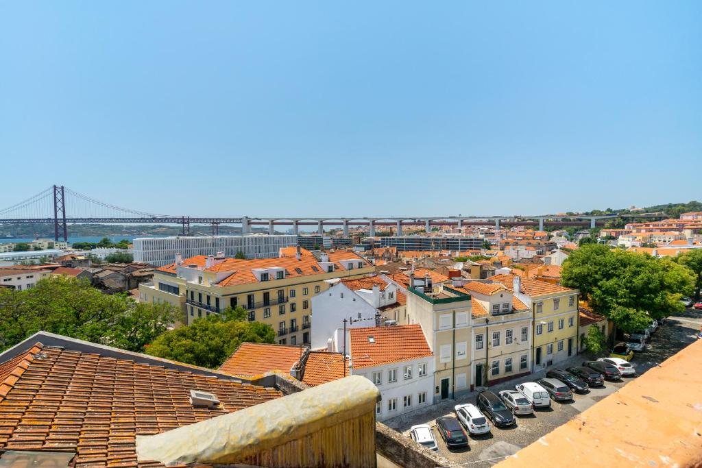 a view of a city with buildings and cars at WHome | Premium River View Apartment in Lisbon