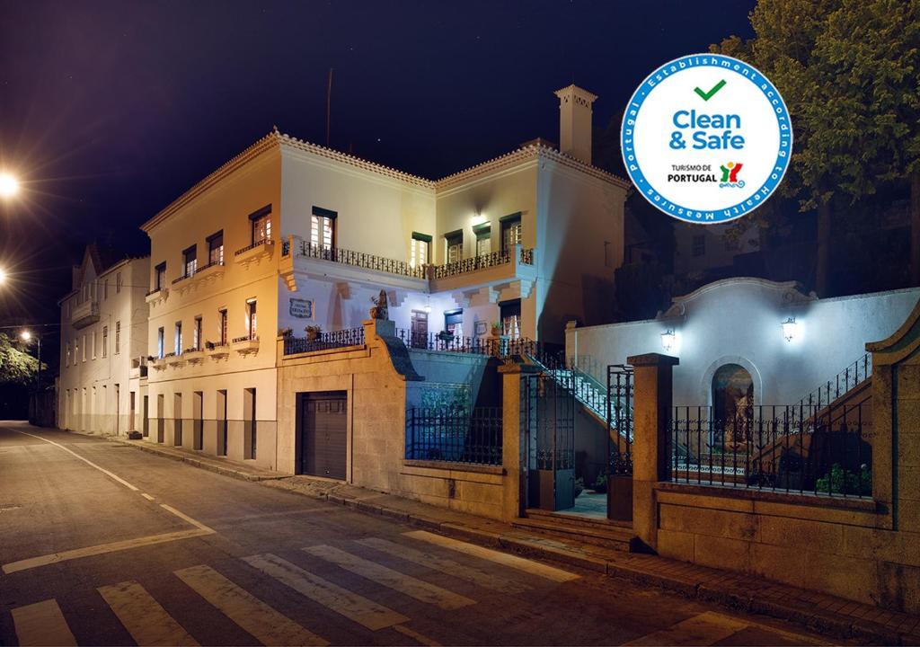 a house with a sign that says clean and safe at Casa do Comendador in Manteigas