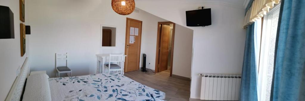 Postel nebo postele na pokoji v ubytování Hotel Estrella del Mar
