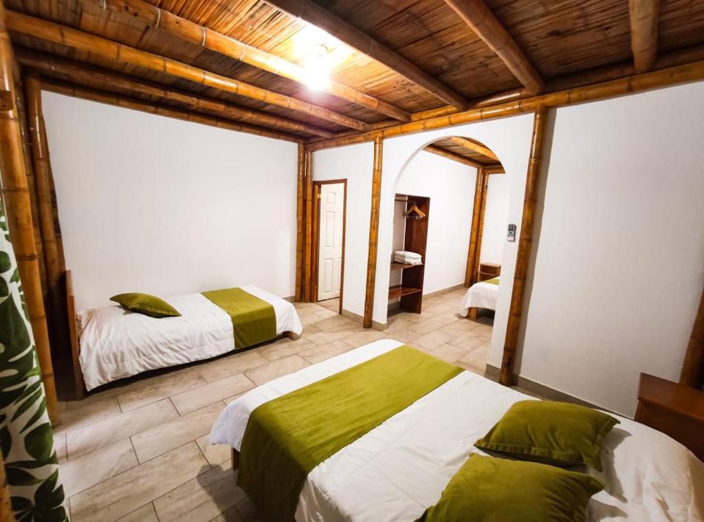 Postel nebo postele na pokoji v ubytování Tuzco Lodge
