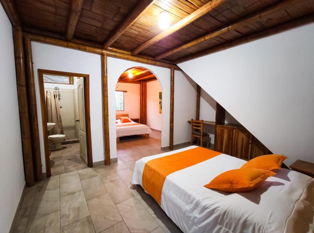 Postel nebo postele na pokoji v ubytování Tuzco Lodge