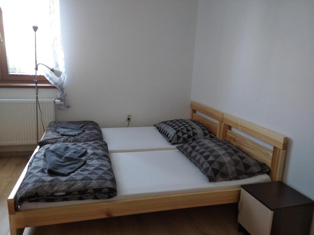 Postel nebo postele na pokoji v ubytování Apartmány Opolany