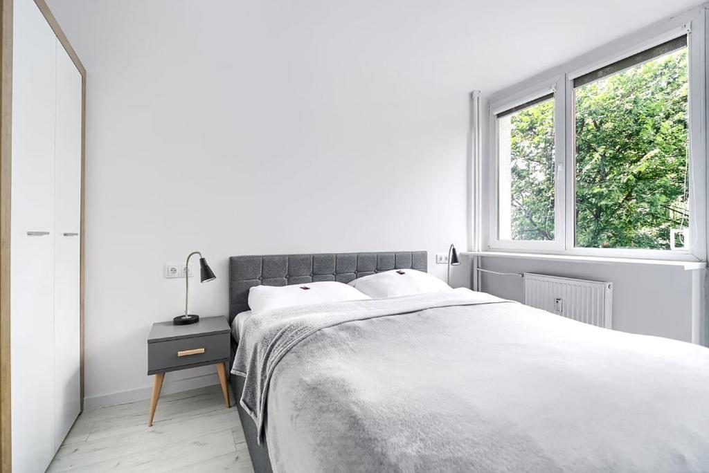 Postel nebo postele na pokoji v ubytování Apartament Matejki II - Unique Apartments