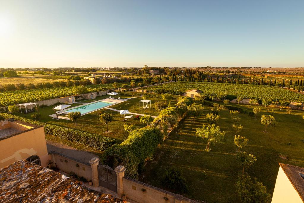 an aerial view of a villa with a garden and a pool at Tenuta Giardini Nuovi in Novoli