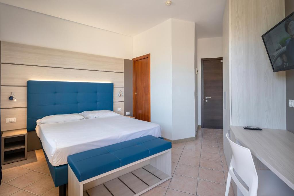 Postel nebo postele na pokoji v ubytování Hotel Gardenia