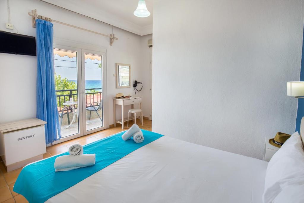 Postel nebo postele na pokoji v ubytování Green Velvet Thassos