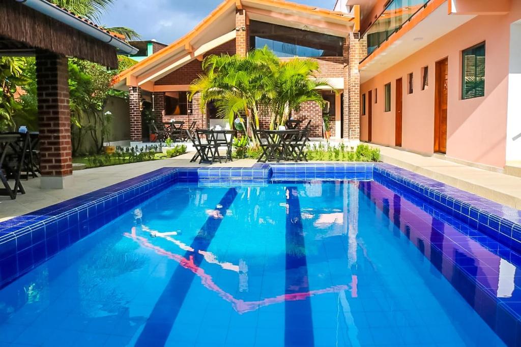 een afbeelding van een zwembad in een huis bij Pousada Málaga in Porto De Galinhas