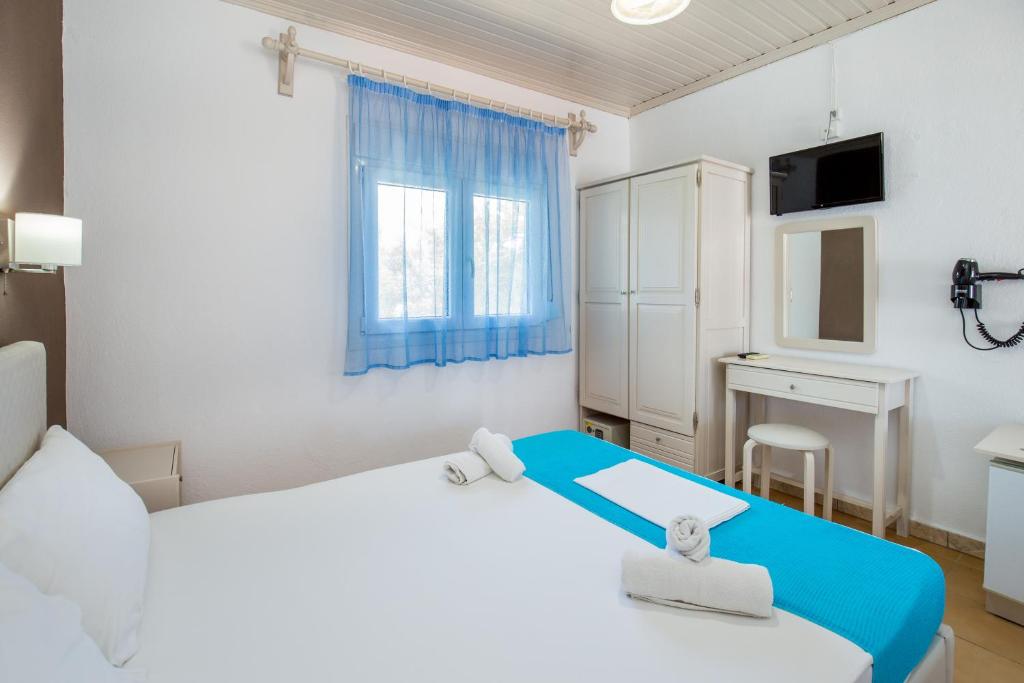 Postel nebo postele na pokoji v ubytování Green Velvet Thassos