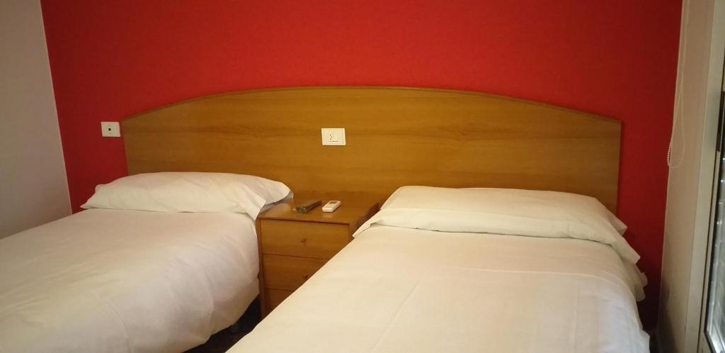 Postel nebo postele na pokoji v ubytování Hostal Meson de Paco