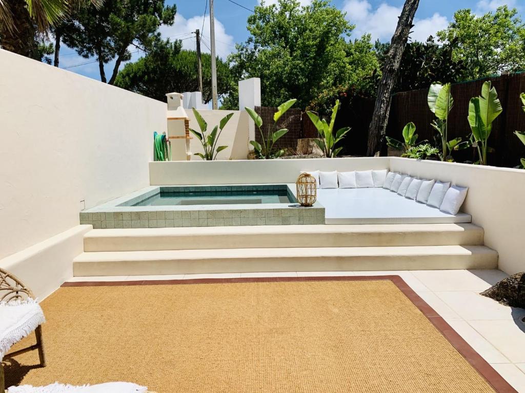 a backyard with a plunge pool and stairs at The Mill - Sintra in Sintra