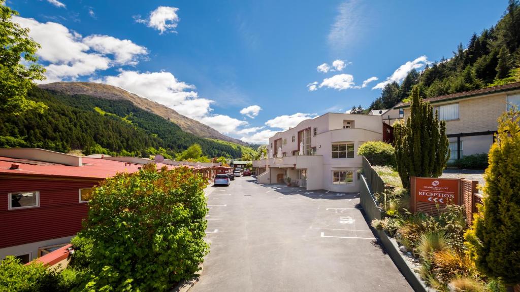 a street in a town with buildings and trees at Cranbury Court Apartments in Queenstown