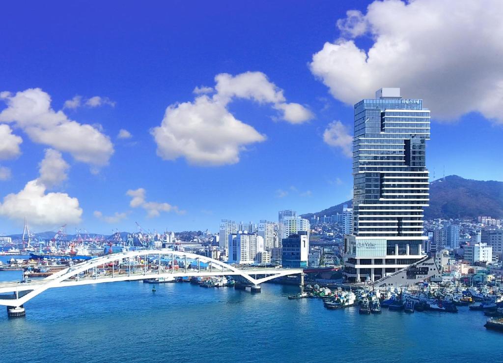 a view of a city with a bridge and a river at Lavalse Hotel in Busan