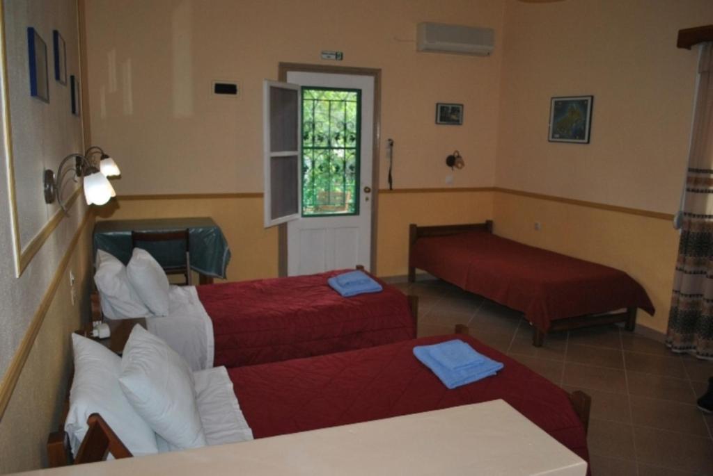 Postel nebo postele na pokoji v ubytování Stelios Studios