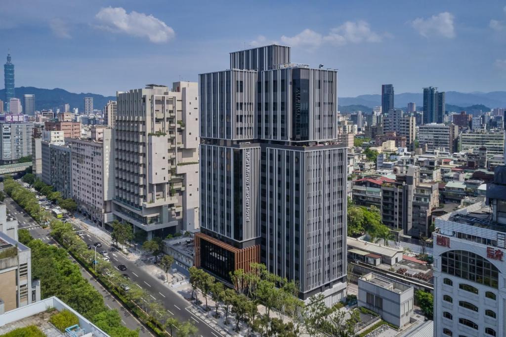 a city with tall buildings and tall buildings at MGH Mitsui Garden Hotel Taipei Zhongxiao in Taipei