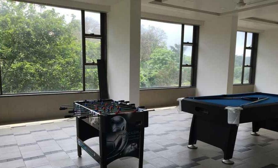 a room with a ping pong table and a pool table at Hotel Lalit Inn in Khandala