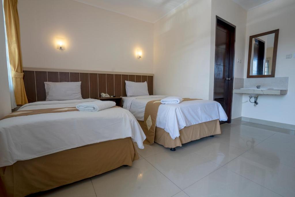 Postel nebo postele na pokoji v ubytování Dago's Hill Hotel