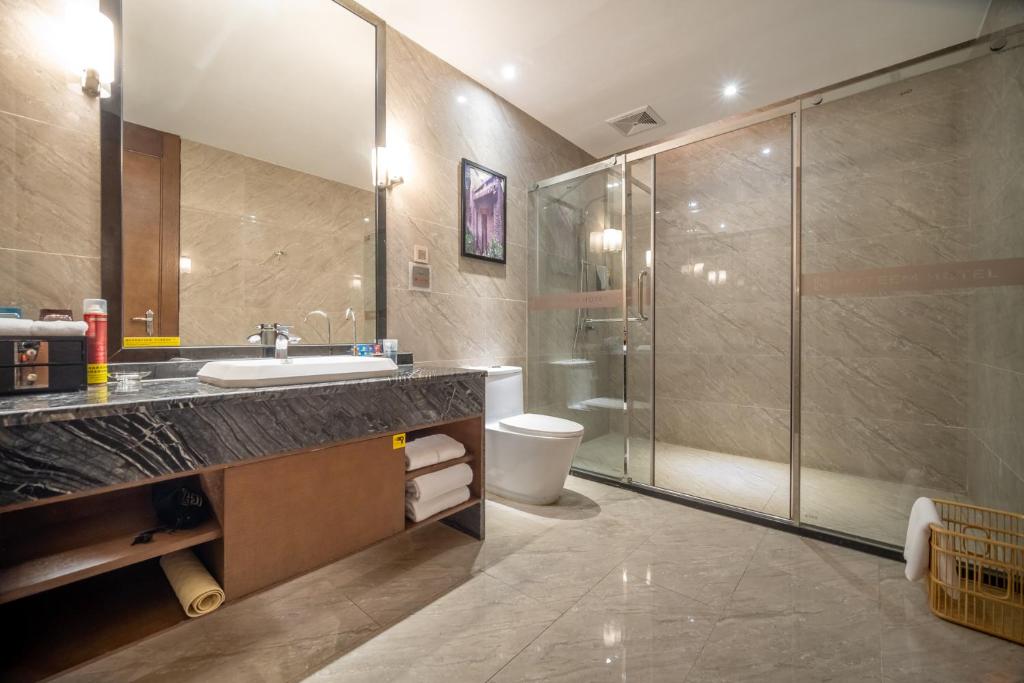 Koupelna v ubytování Relteem Hotel