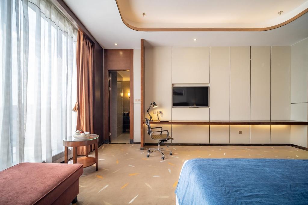 TV a/nebo společenská místnost v ubytování Relteem Hotel
