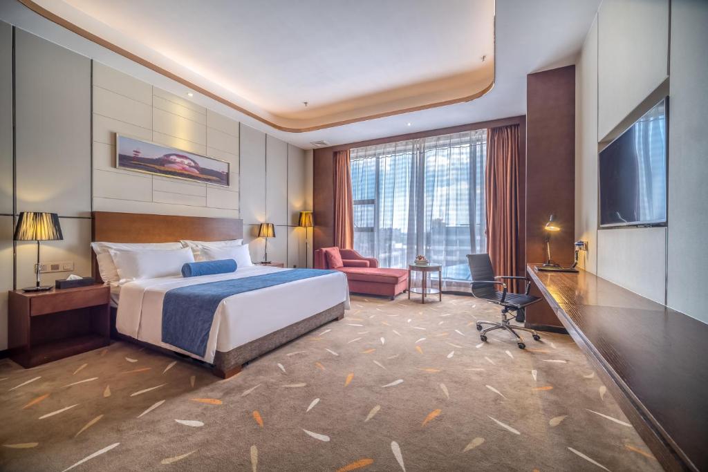 Postel nebo postele na pokoji v ubytování Relteem Hotel