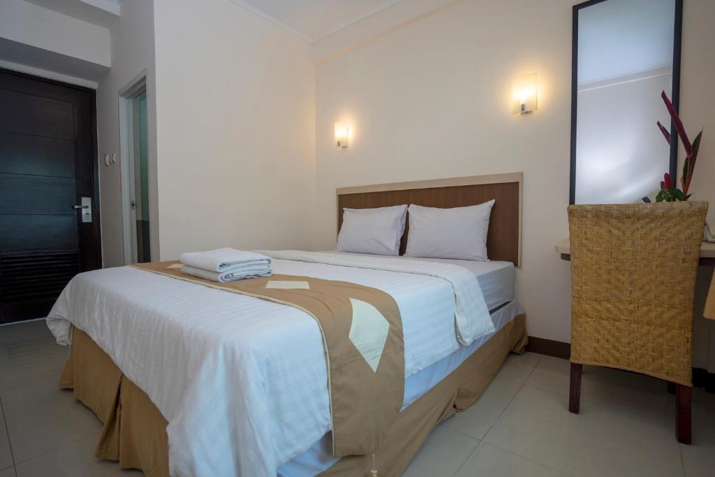 Postel nebo postele na pokoji v ubytování Dago's Hill Hotel