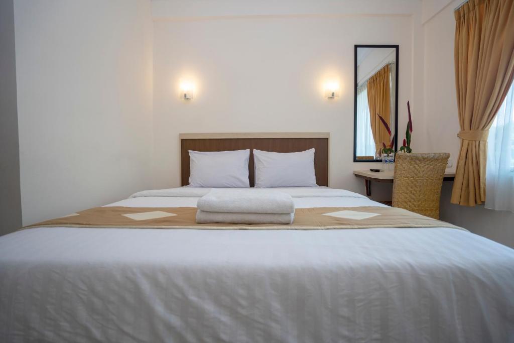 Postel nebo postele na pokoji v ubytování Dago's Hill Hotel
