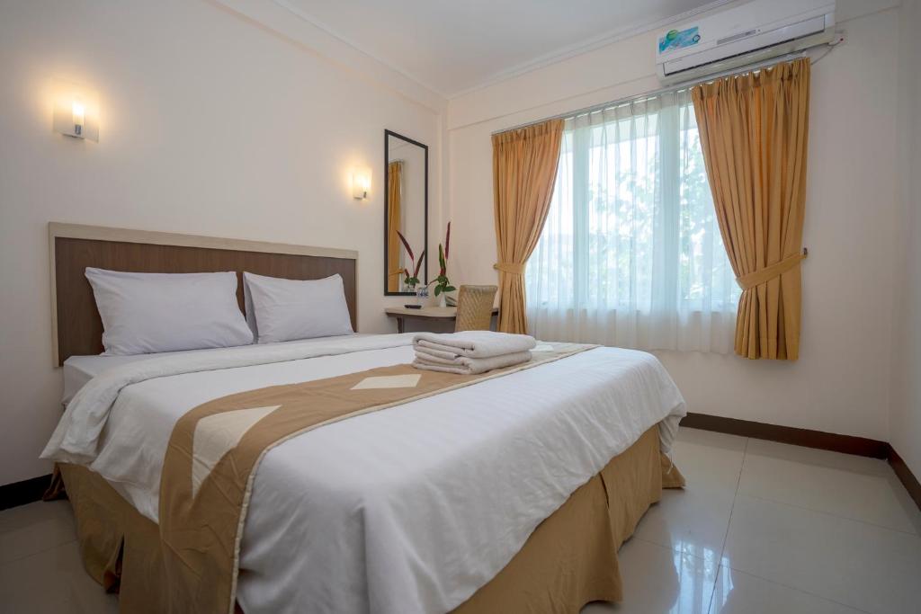 Postel nebo postele na pokoji v ubytování Dago's Hill Hotel