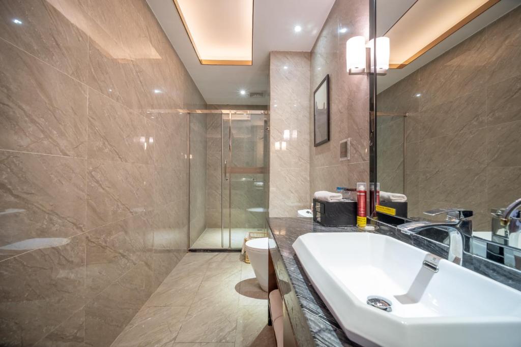 Koupelna v ubytování Relteem Hotel