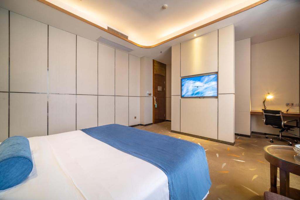 TV a/nebo společenská místnost v ubytování Relteem Hotel
