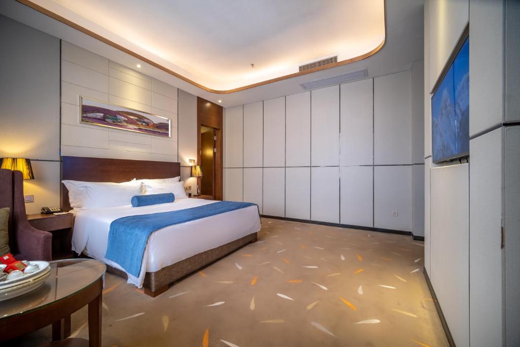 Postel nebo postele na pokoji v ubytování Relteem Hotel