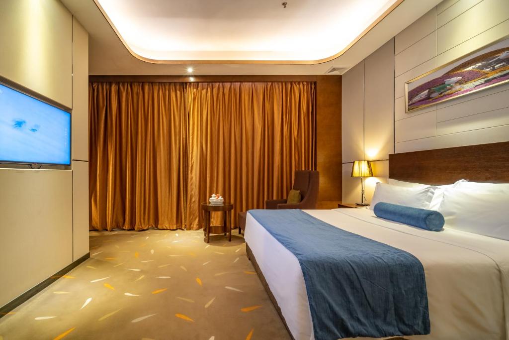 Postel nebo postele na pokoji v ubytování Relteem Hotel