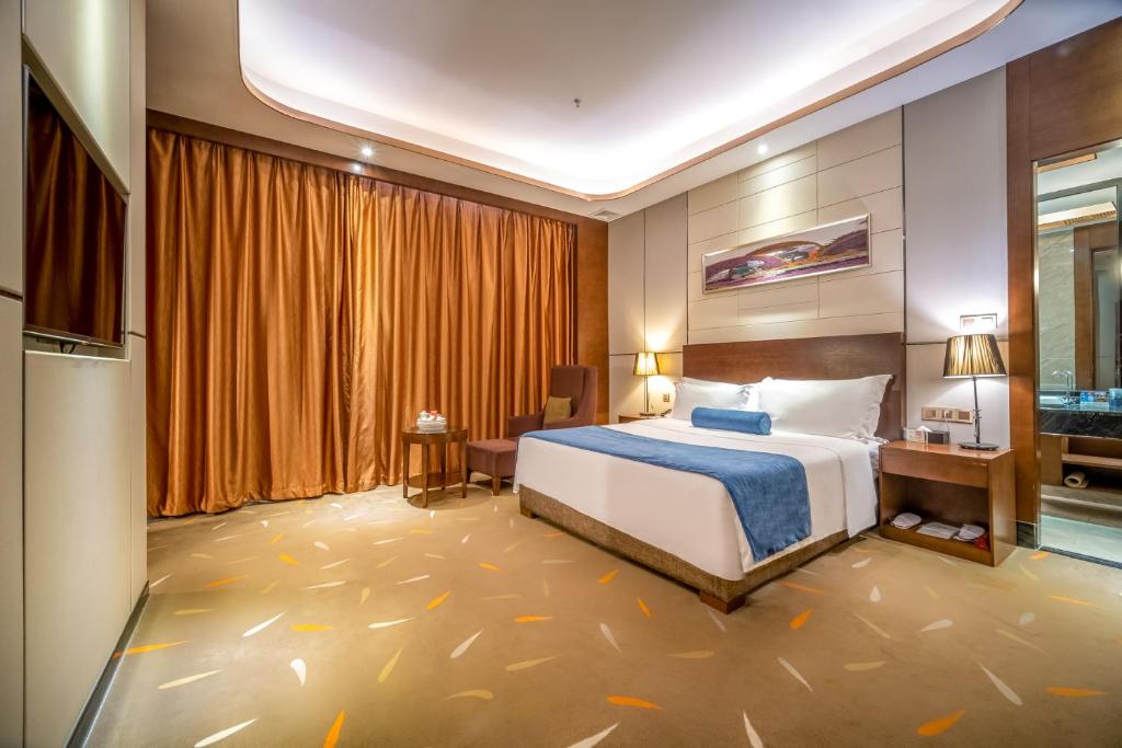 Postel nebo postele na pokoji v ubytování Relteem Hotel