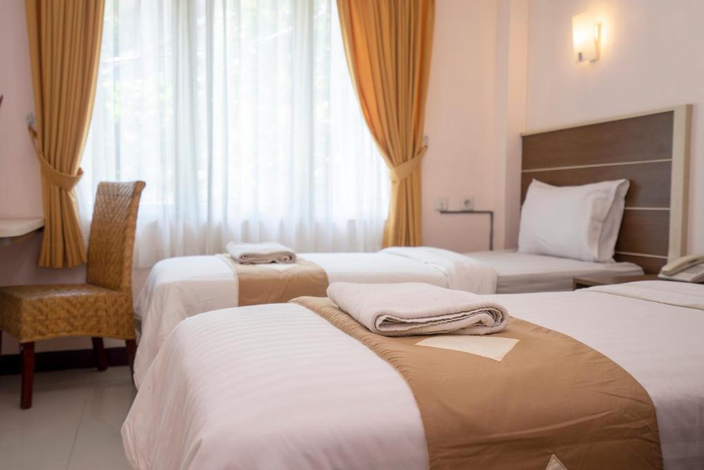 Postel nebo postele na pokoji v ubytování Dago's Hill Hotel