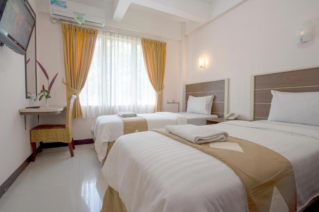 Postel nebo postele na pokoji v ubytování Dago's Hill Hotel