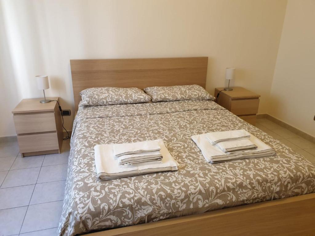 Łóżko lub łóżka w pokoju w obiekcie COCO Apartments