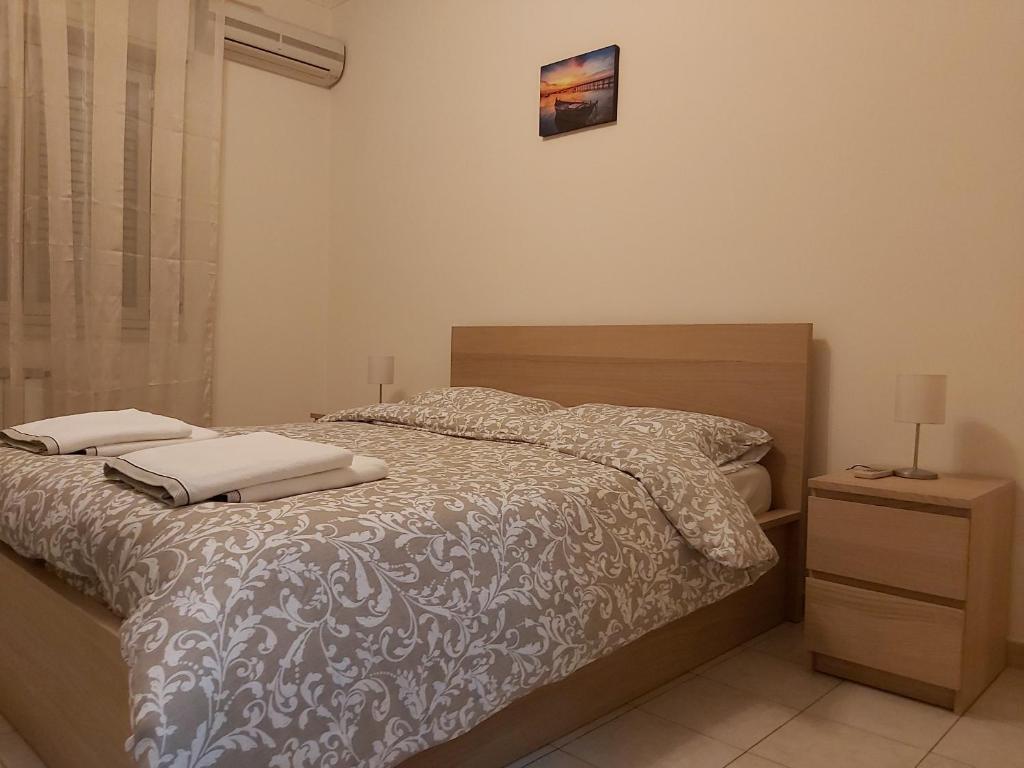 Łóżko lub łóżka w pokoju w obiekcie COCO Apartments