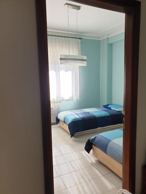 Łóżko lub łóżka w pokoju w obiekcie COCO Apartments