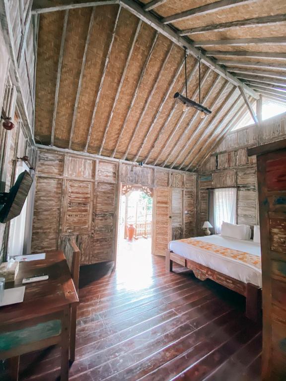 Postel nebo postele na pokoji v ubytování Umah Kayu Ubud