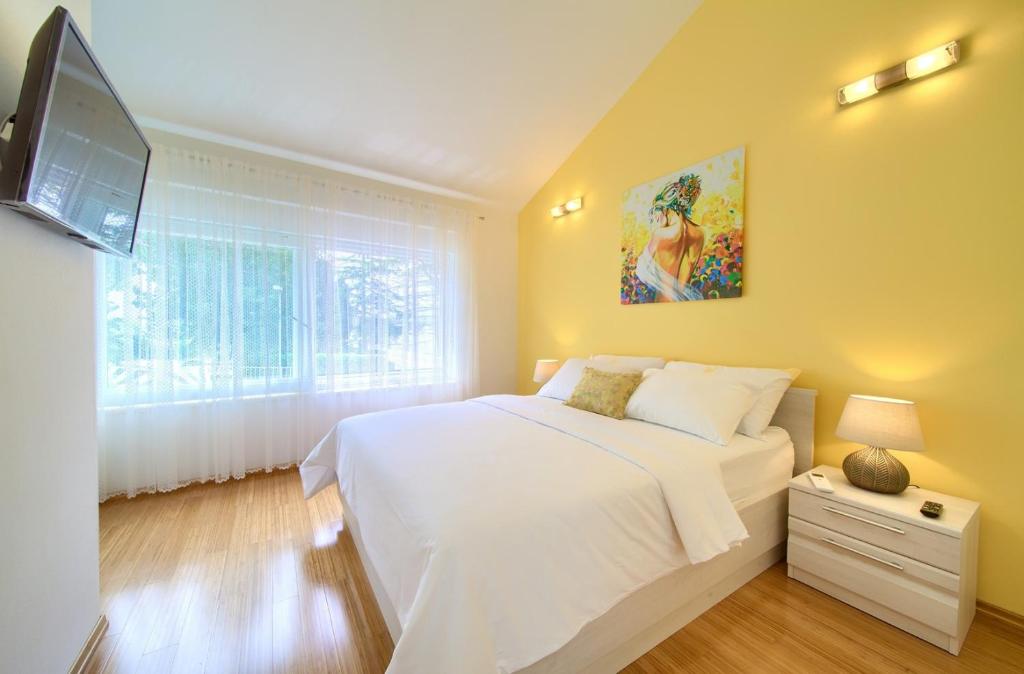 Postel nebo postele na pokoji v ubytování Holiday House Mar