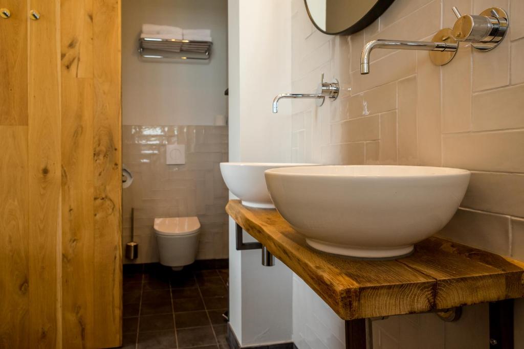 Koupelna v ubytování Loods Logement