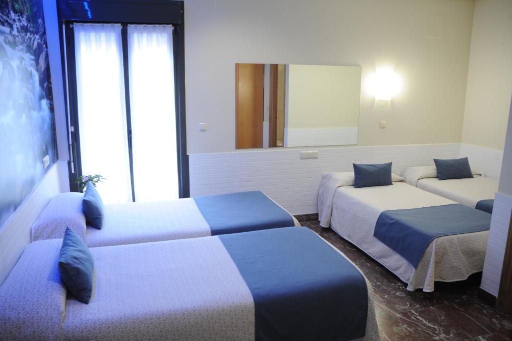 Postel nebo postele na pokoji v ubytování Hotel Aitana