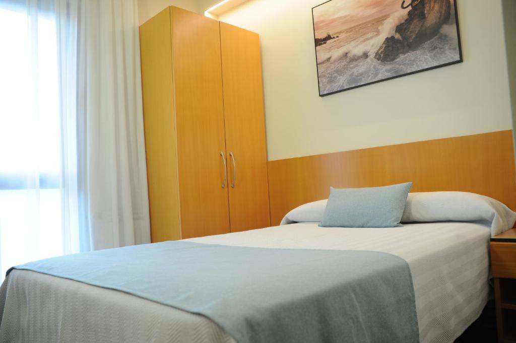 Postel nebo postele na pokoji v ubytování Hotel Aitana