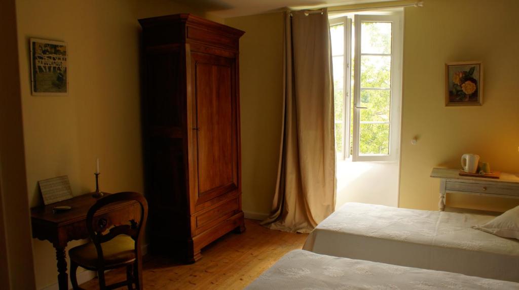 Postel nebo postele na pokoji v ubytování Chambres d'hôtes La Hourqueyre