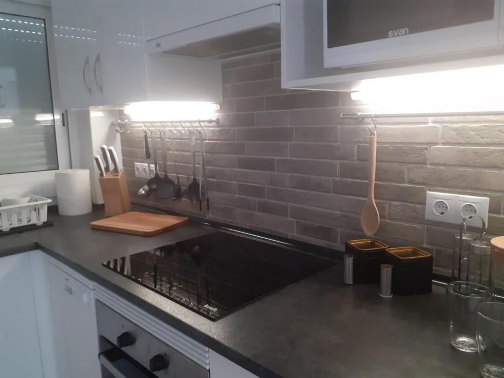 Kuchyňa alebo kuchynka v ubytovaní White Apartment