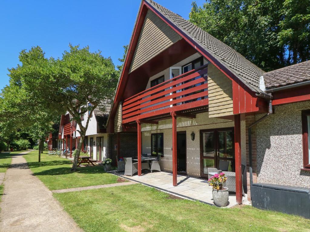 a house with red wooden beams on it at 32 Trevithick in Hayle