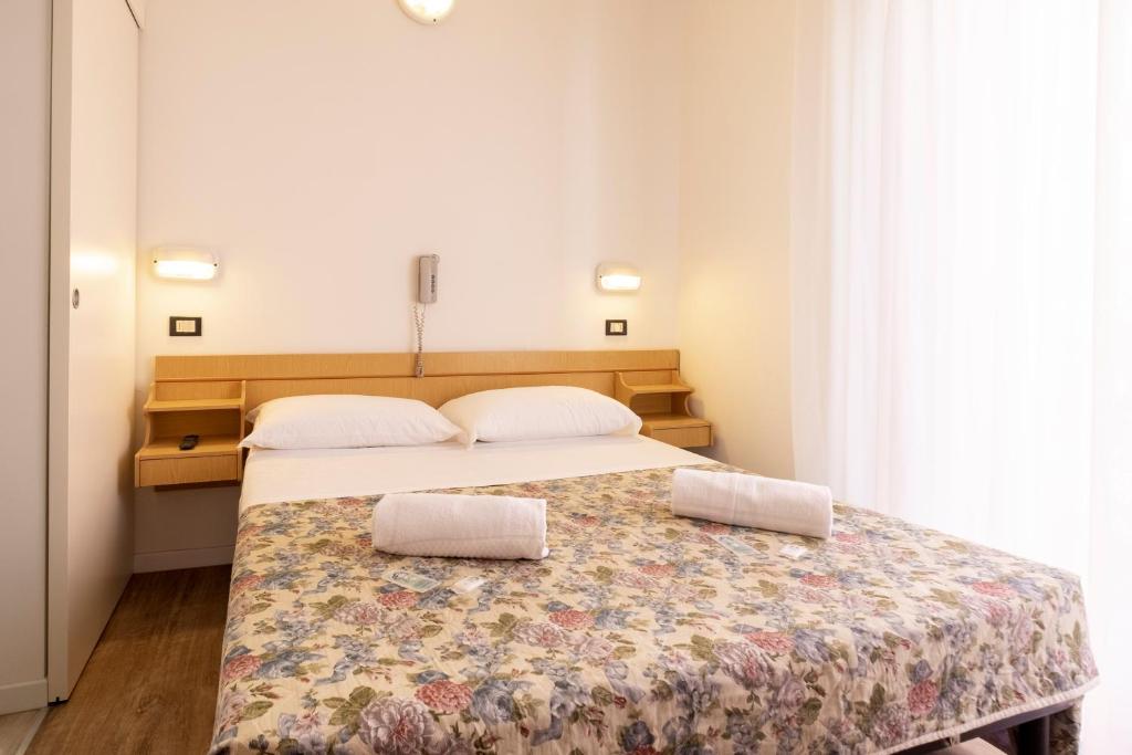 Postel nebo postele na pokoji v ubytování Hotel Lexington