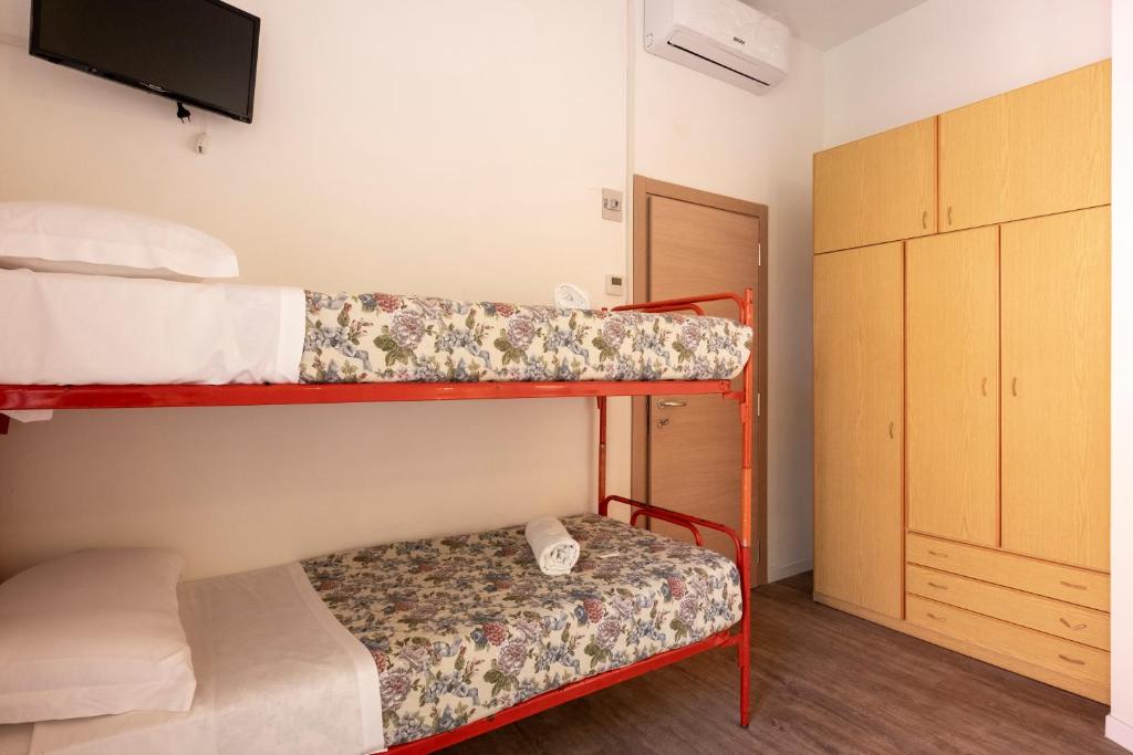 Postel nebo postele na pokoji v ubytování Hotel Lexington