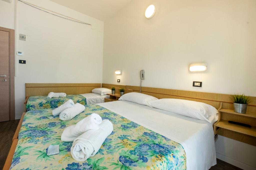 Postel nebo postele na pokoji v ubytování Hotel Lexington